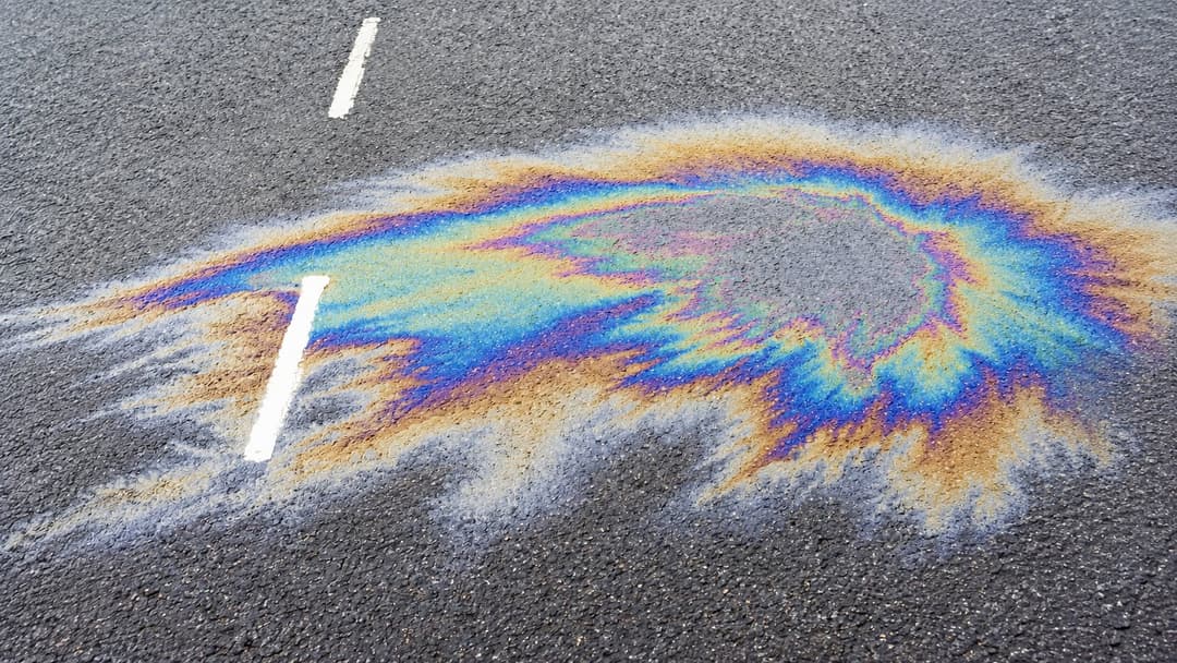 Oil spill on tarmac requiring clean-up